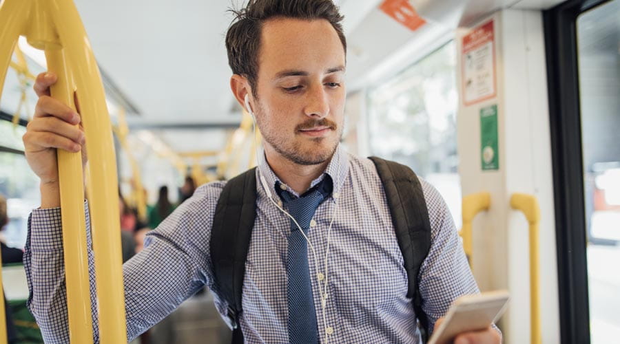 Man commuting to work on public transport