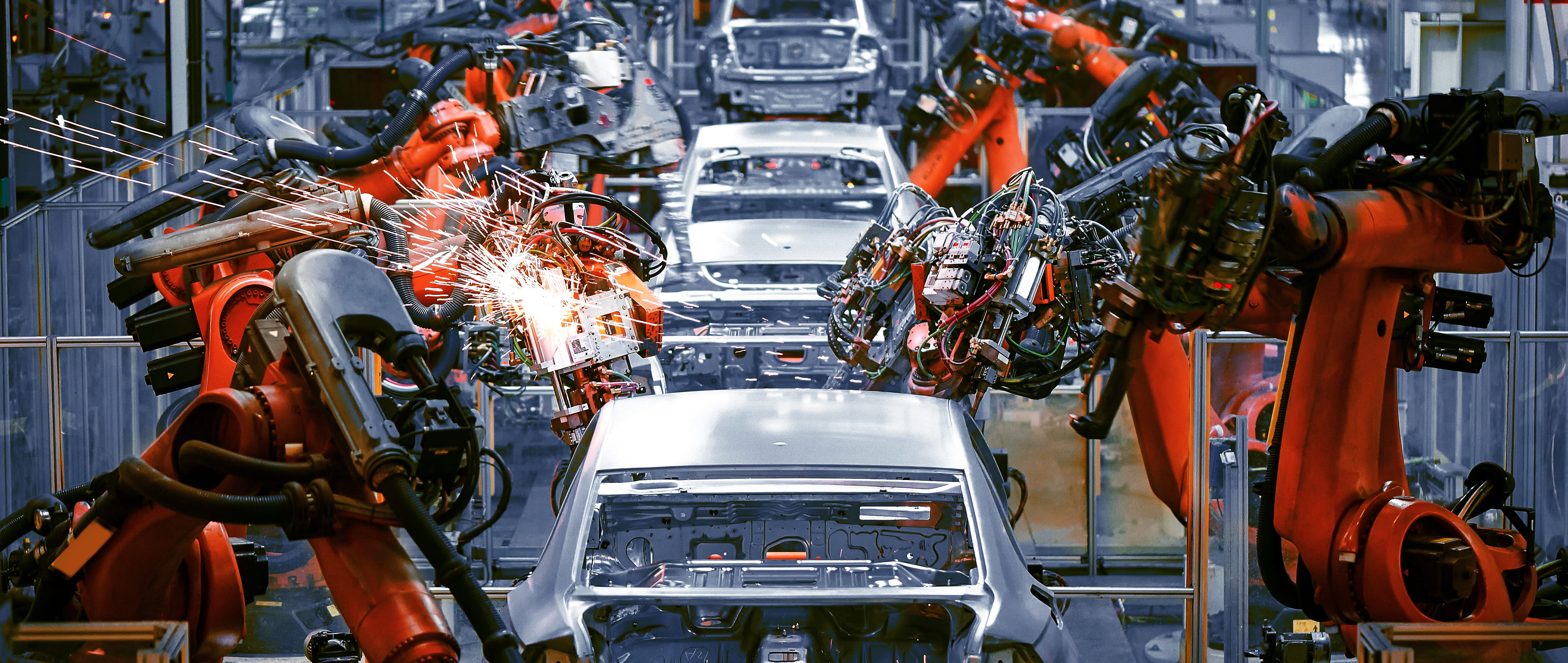 Automotive assembly line manufacturing vehicles using advanced technology.